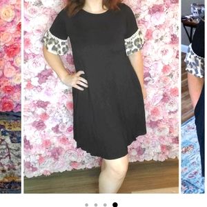 ANIMAL PRINT RUFFLE CONTRAST BLACK DRESS MED/LARGE.